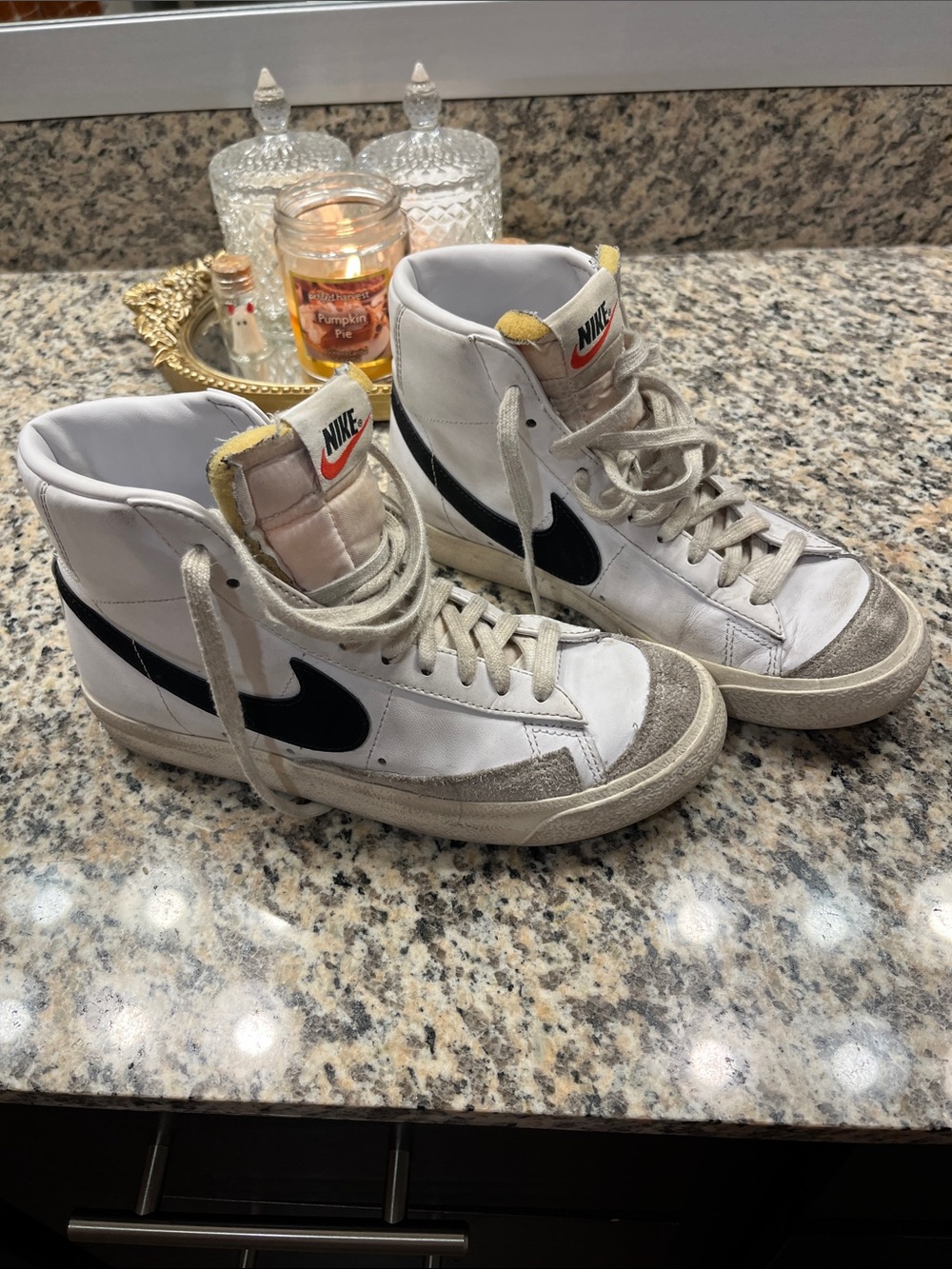 Nike White High-Top Sneakers with Black Swoosh and Yellow Tongue Accent